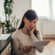 Woman staring at a piece of paper