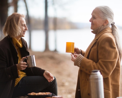 Two people at the lake talking